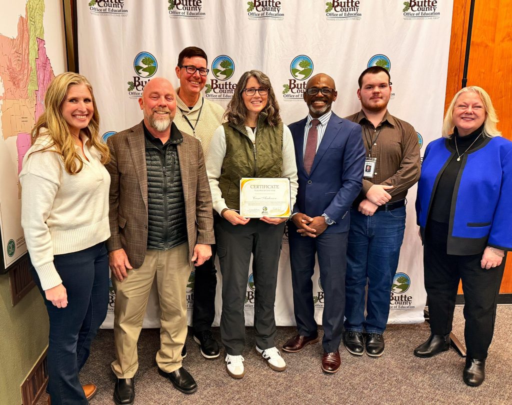 Cami Anderson holds an award for CAPHERD Teacher of the Year with the Butte County Board of Education and Superintendent of Schools Mary Sakuma