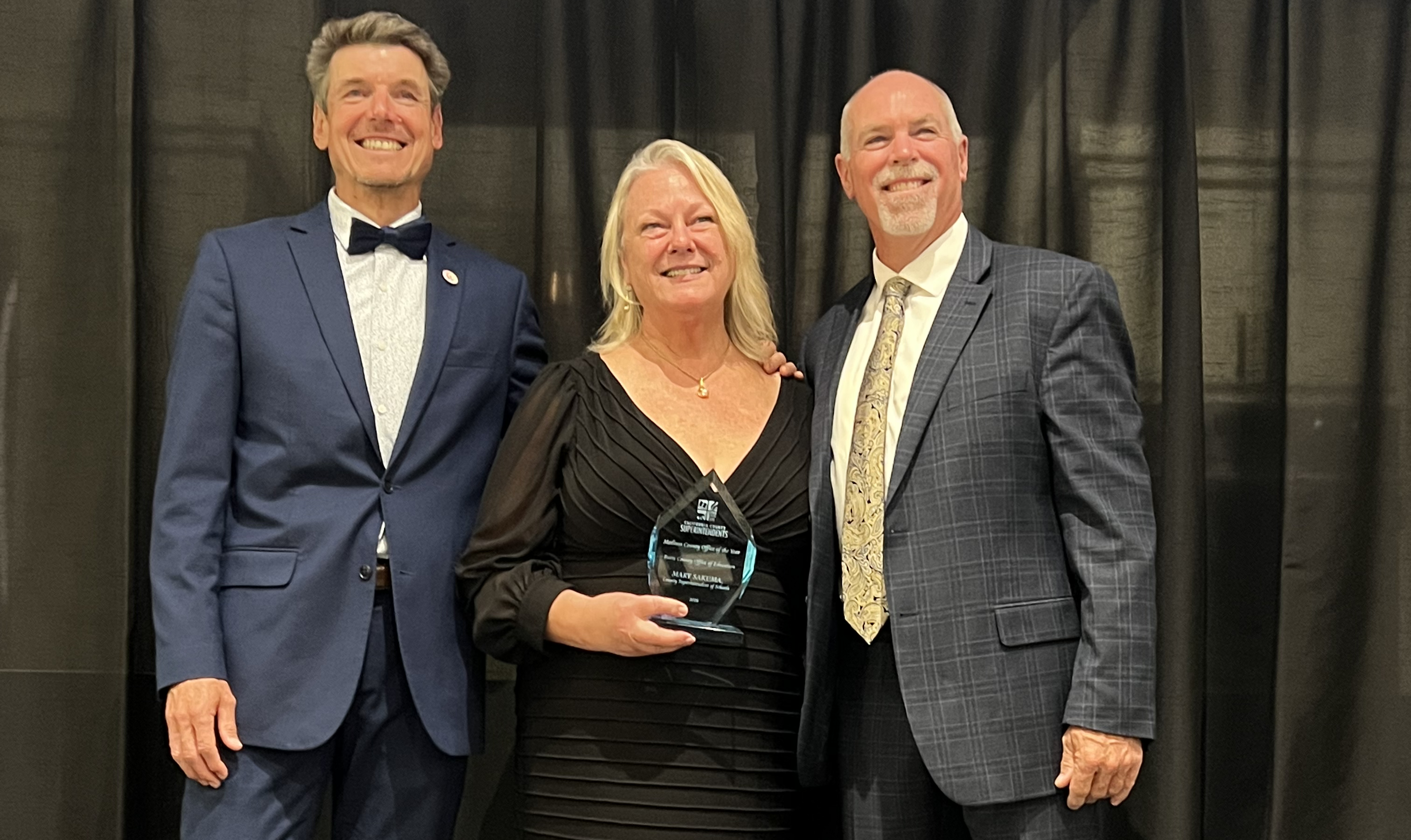 BCOE Superintendent of Schools Mary Sakuma smiles and accepts a Leadership Award as BCOE won 2026 Medium County of the Year